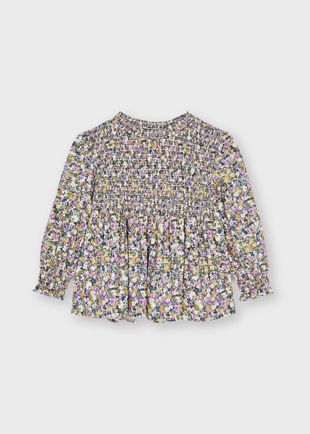BLUSA NIDO DE ABEJA NIÑA ESTAMPADO DE FLORES.
